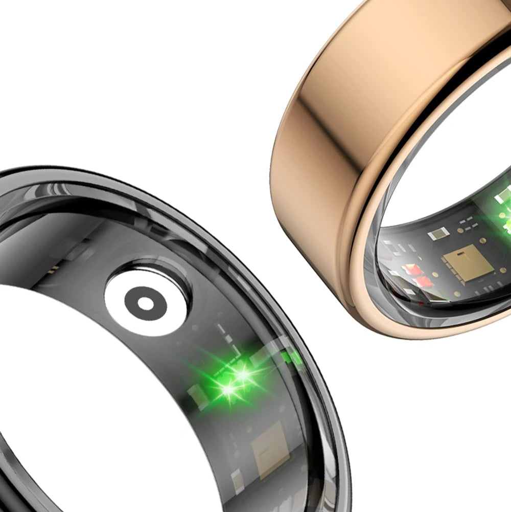 Two smart rings, one black and one gold, with green lights on a white background.